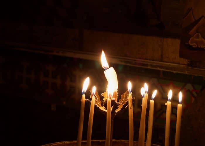 votive lights at the Holy Sepulchre holy land pilgrimage tour