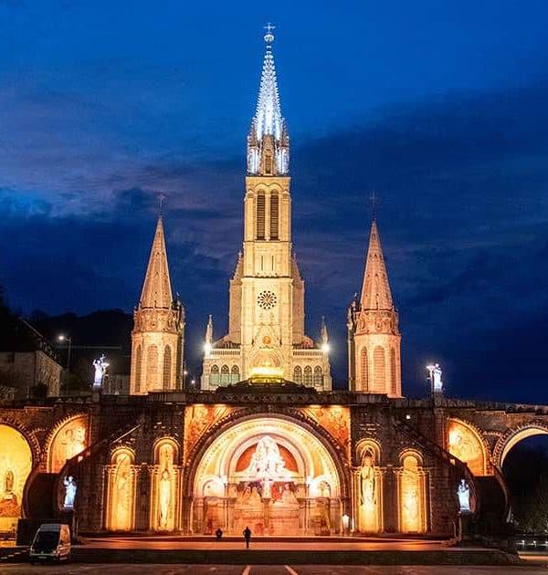 lourdes basilica at night pilgrimage tour