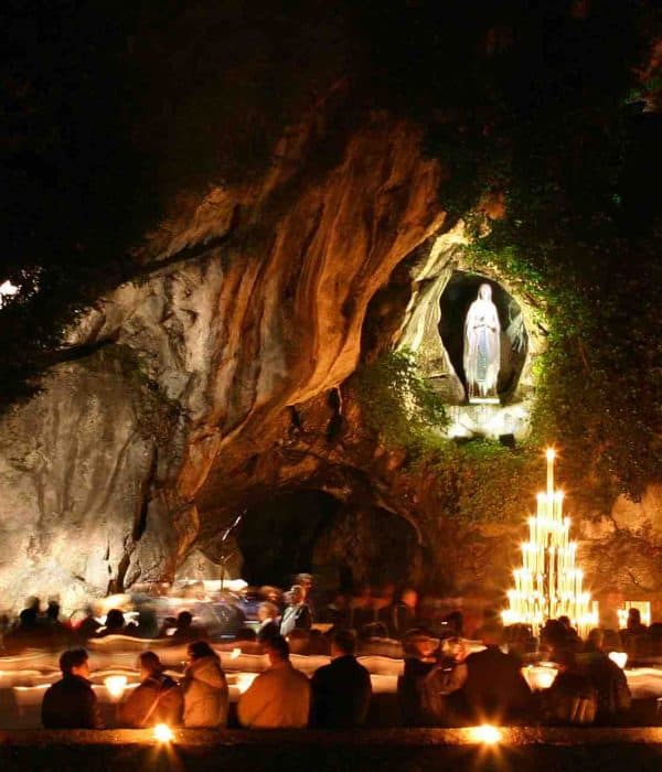 lourdes grotto at night pilgrimage tour