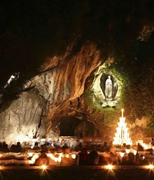 lourdes grotto at night again pilgrimage tour