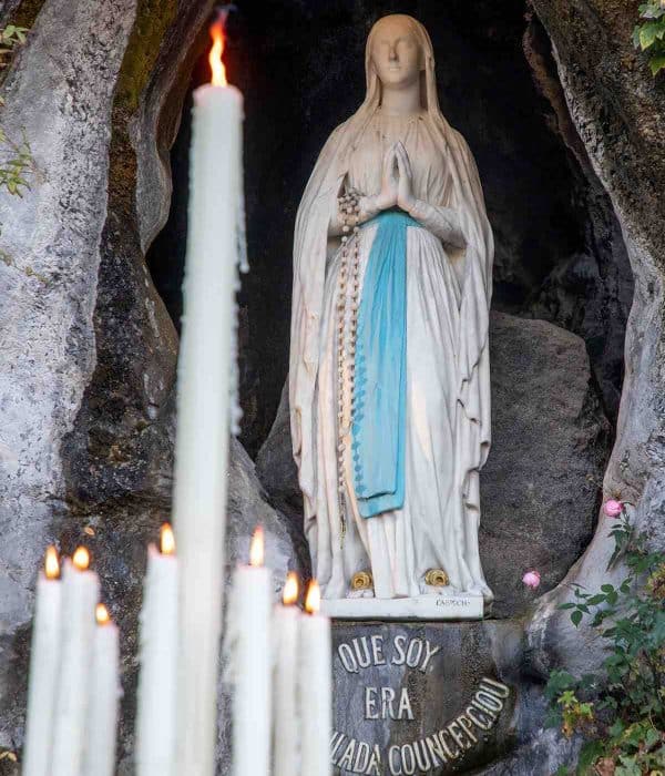 Our Lady of Lourdes with candles pilgrimage tour