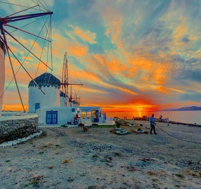 Mykonos sunset with windmills greece pilgrimage tour